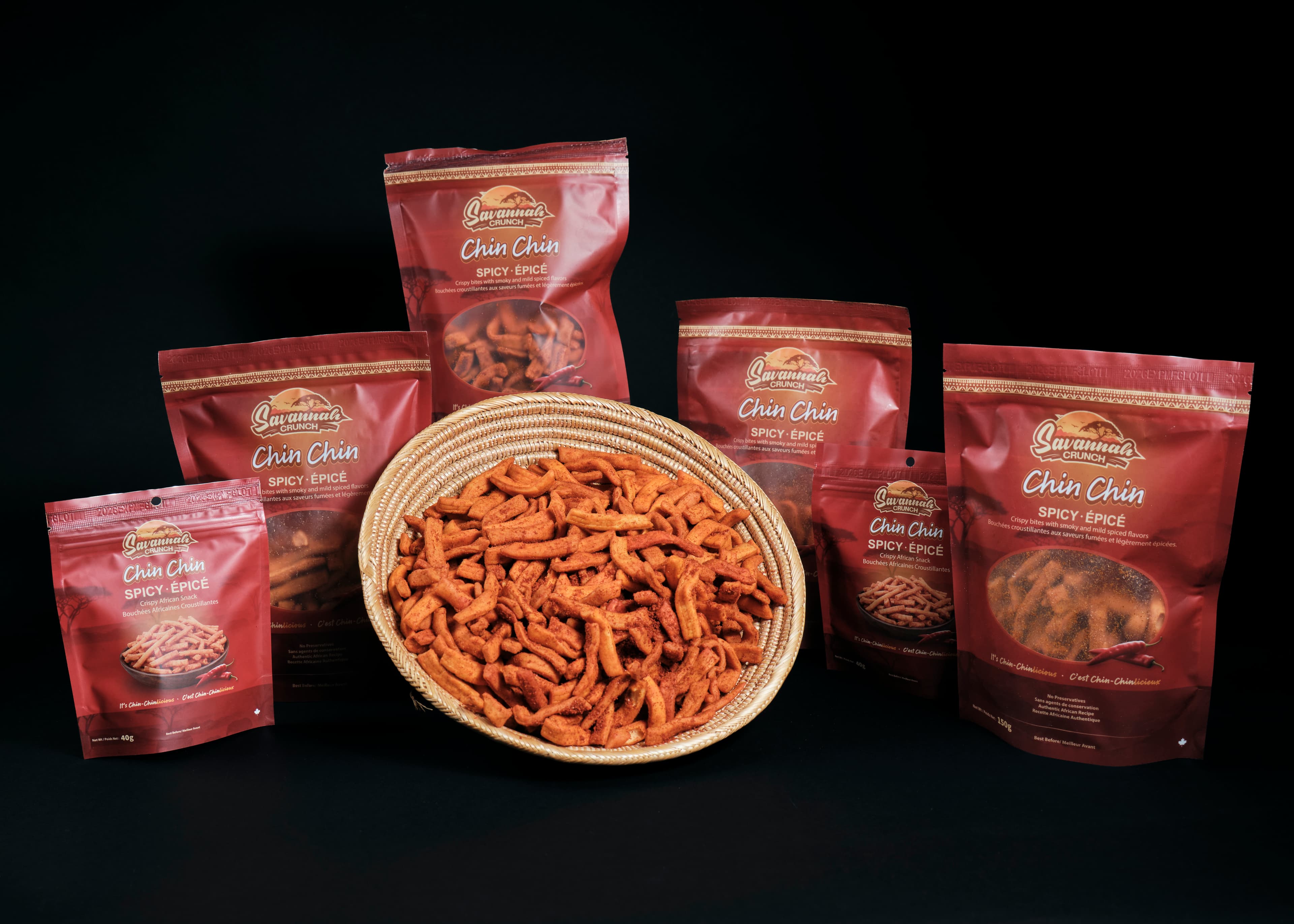 Savannah Crunch Chin Chin BBQ bags and a basket of chin chin